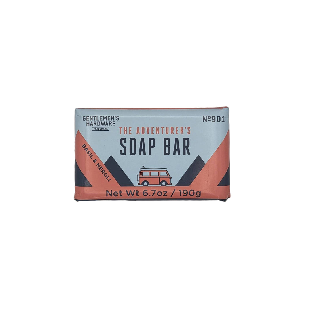 Soap bar packaging with 'The Adventurer's Soap Bar' branding on a light gray background