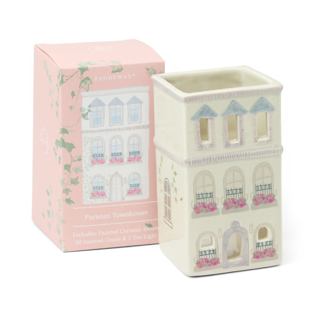 Decorative wax warmer with Parisian Townhouse design next to its packaging on a white background