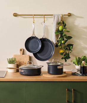 A collection of Le Creuset Ceramic non stick cookware in a kitchen.