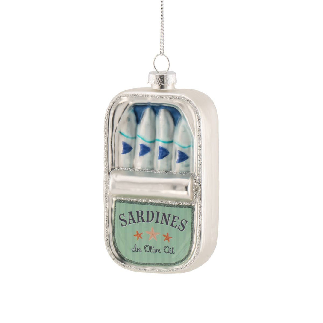 Decorative ornament shaped like a can of sardines on a white background