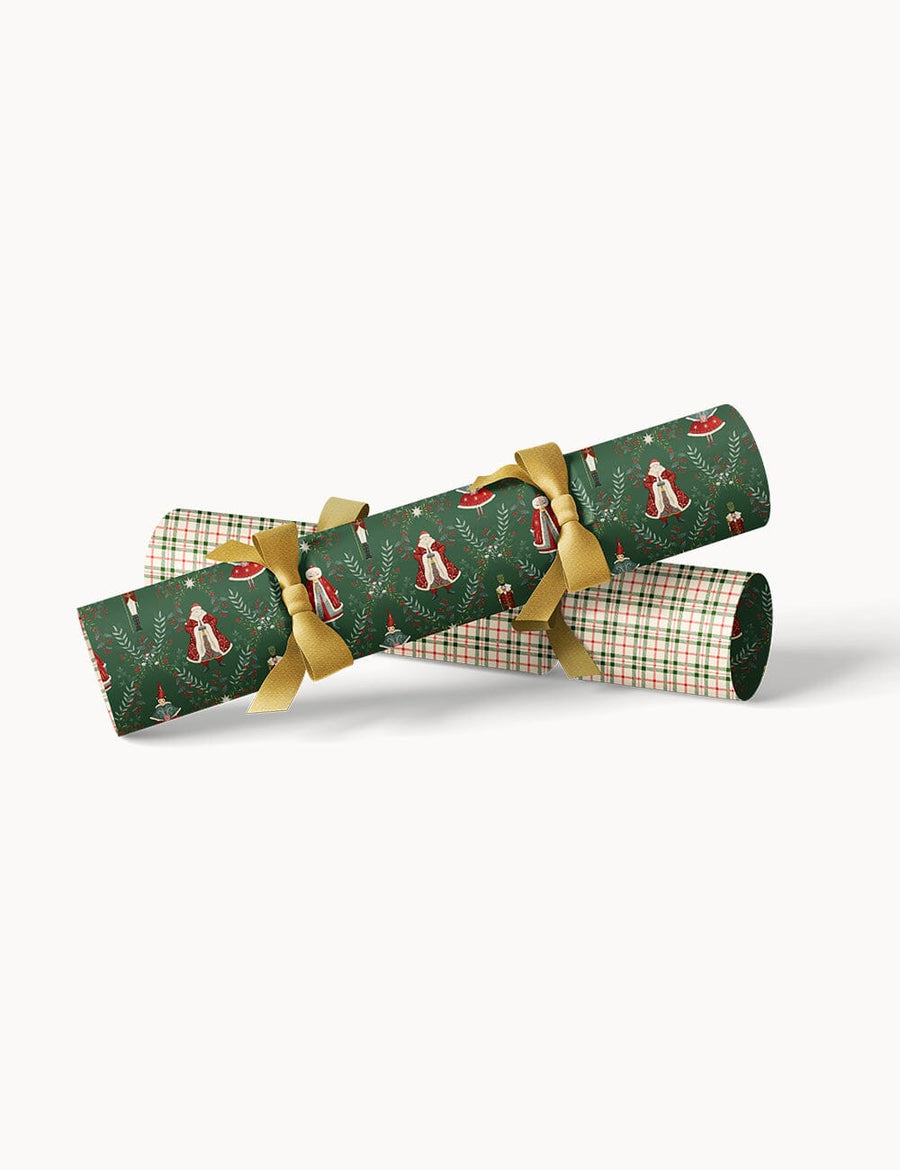 Christmas crackers with gold ribbons on a white background