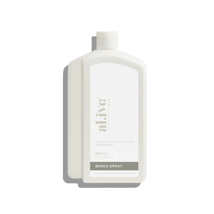 White bottle of 'alive' bench spray refill on a white background