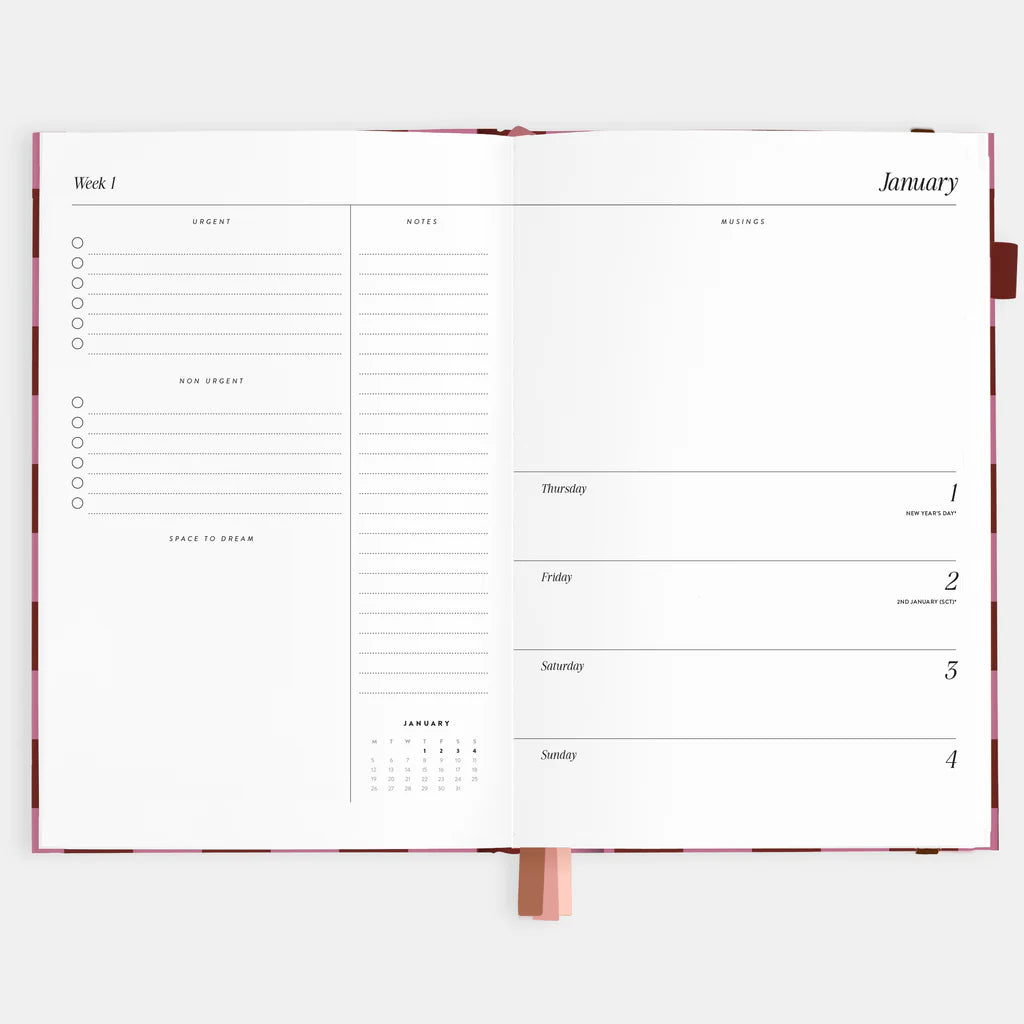 Open planner showing a weekly layout with a calendar on a white background