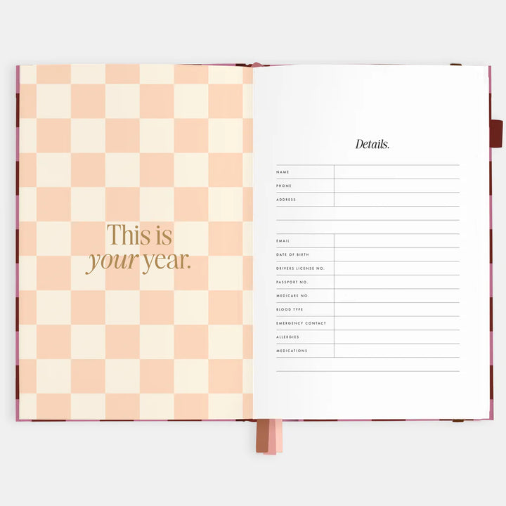 Open book with checkered cover and text on a white background