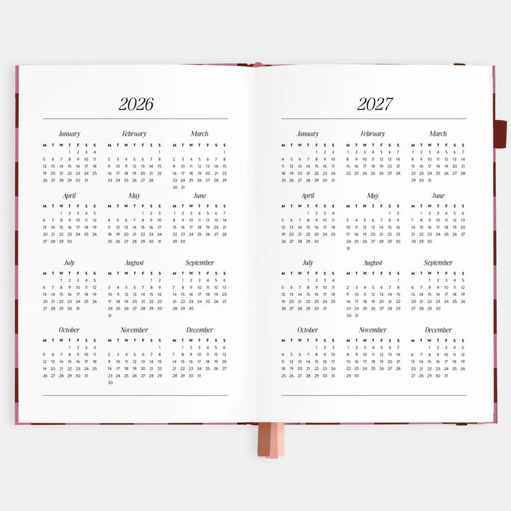 Calendar open to pages showing years 2026 and 2027 on a white background
