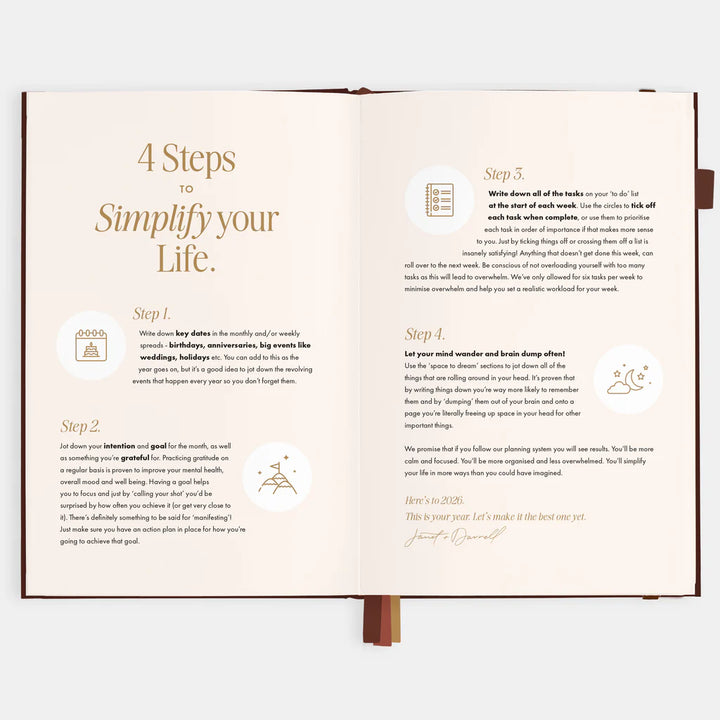 Open planner with steps to simplify your life on a white background