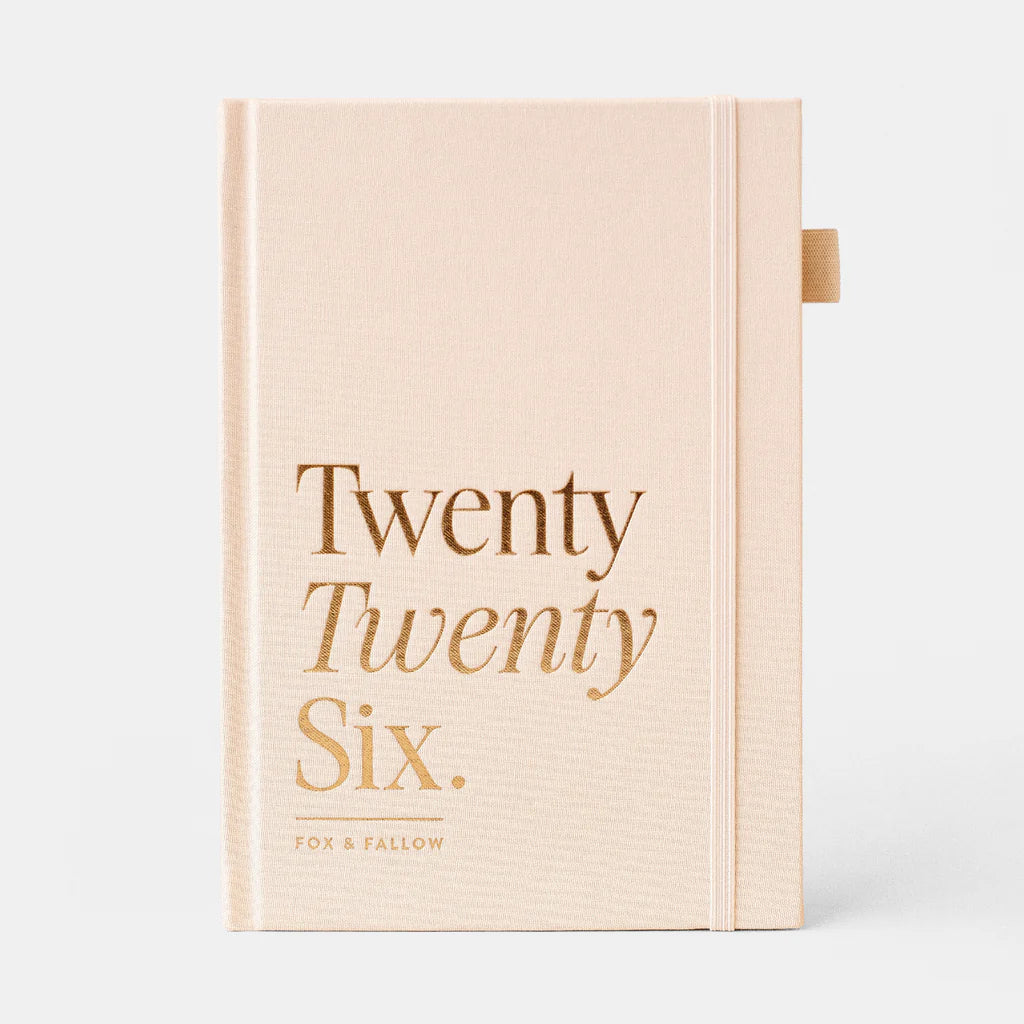 Beige yearly planner with 'Twenty Twenty Six' text on a white background