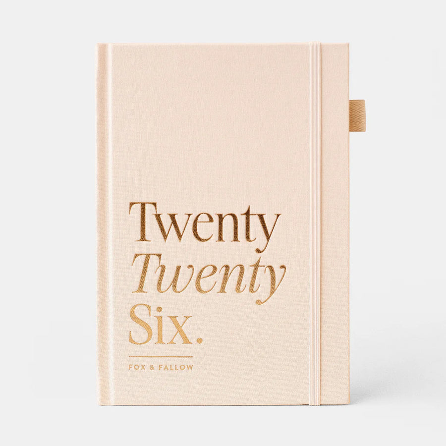 Beige yearly planner with 'Twenty Twenty Six' text on a white background