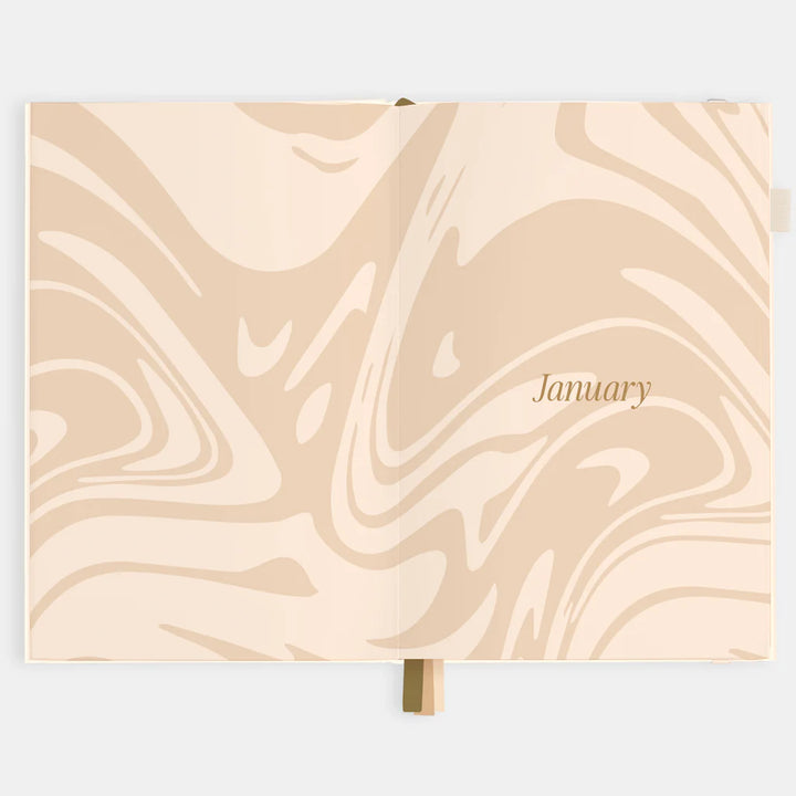 Calendar with beige marble design and 'January' text on a light gray background