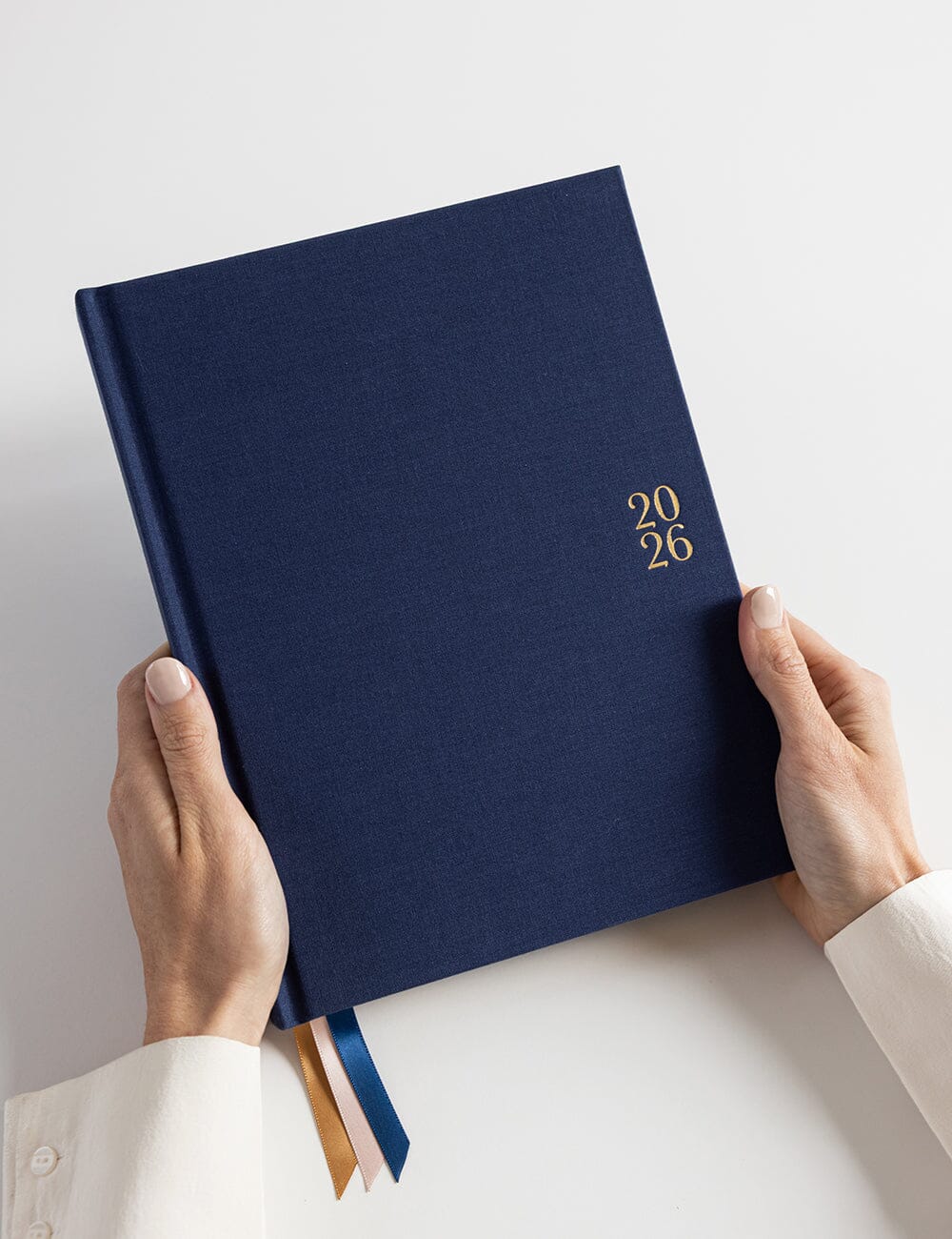 Navy blue planner with '2026' on a white background