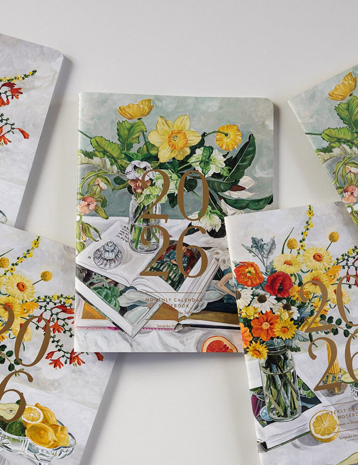 Decorative calendar with floral and vintage design on a white surface