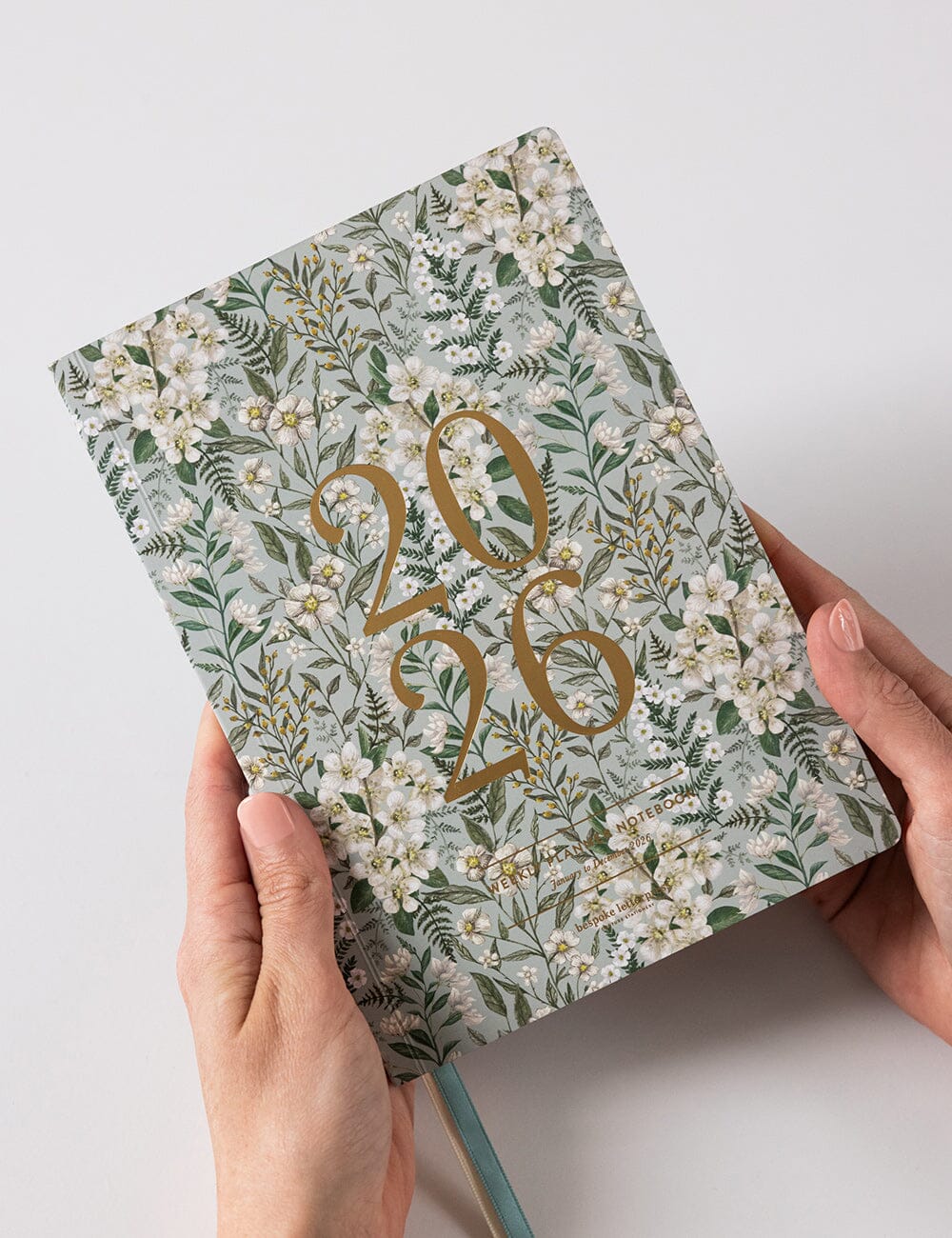 Floral notebook with '2026' on a light background