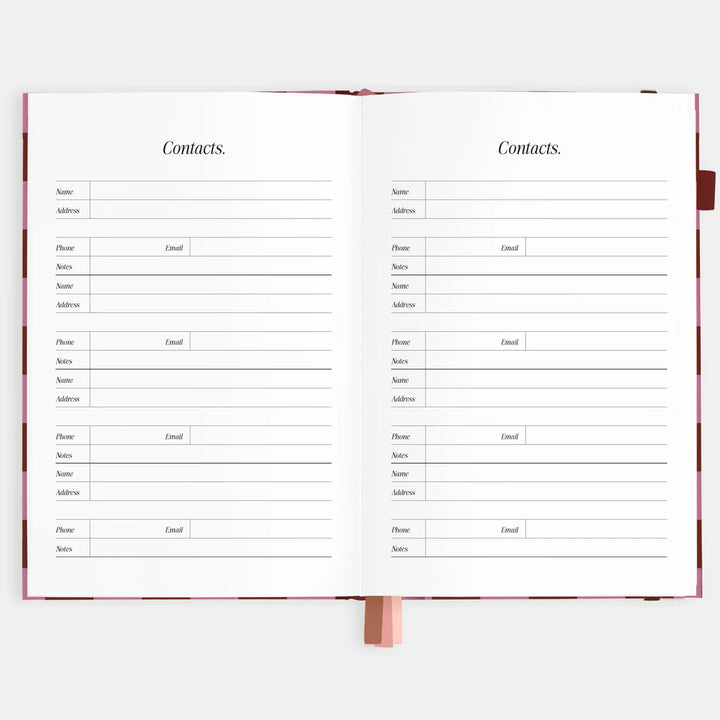 Open book showing a contacts page with columns for name, address, phone, email, and notes.