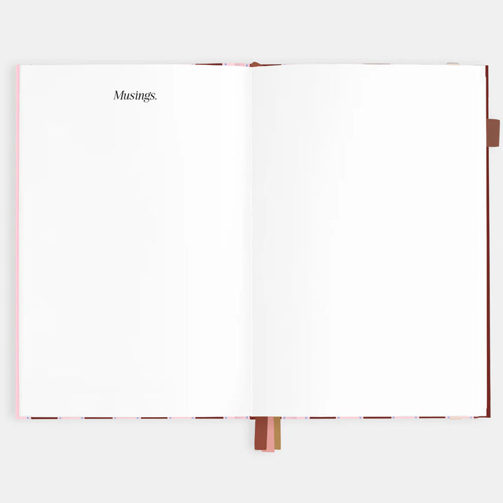 Open notebook with 'Musings' on a white background