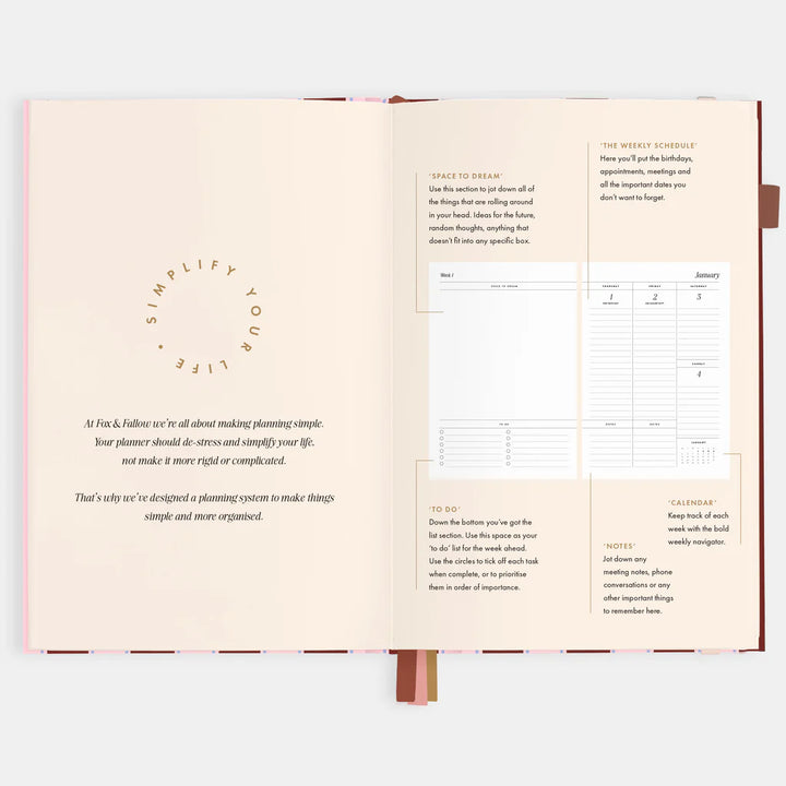 Open planner with text and a calendar on a white background