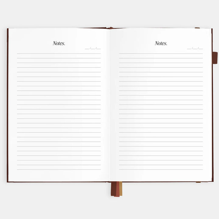 Open notebook with lined pages on a white background