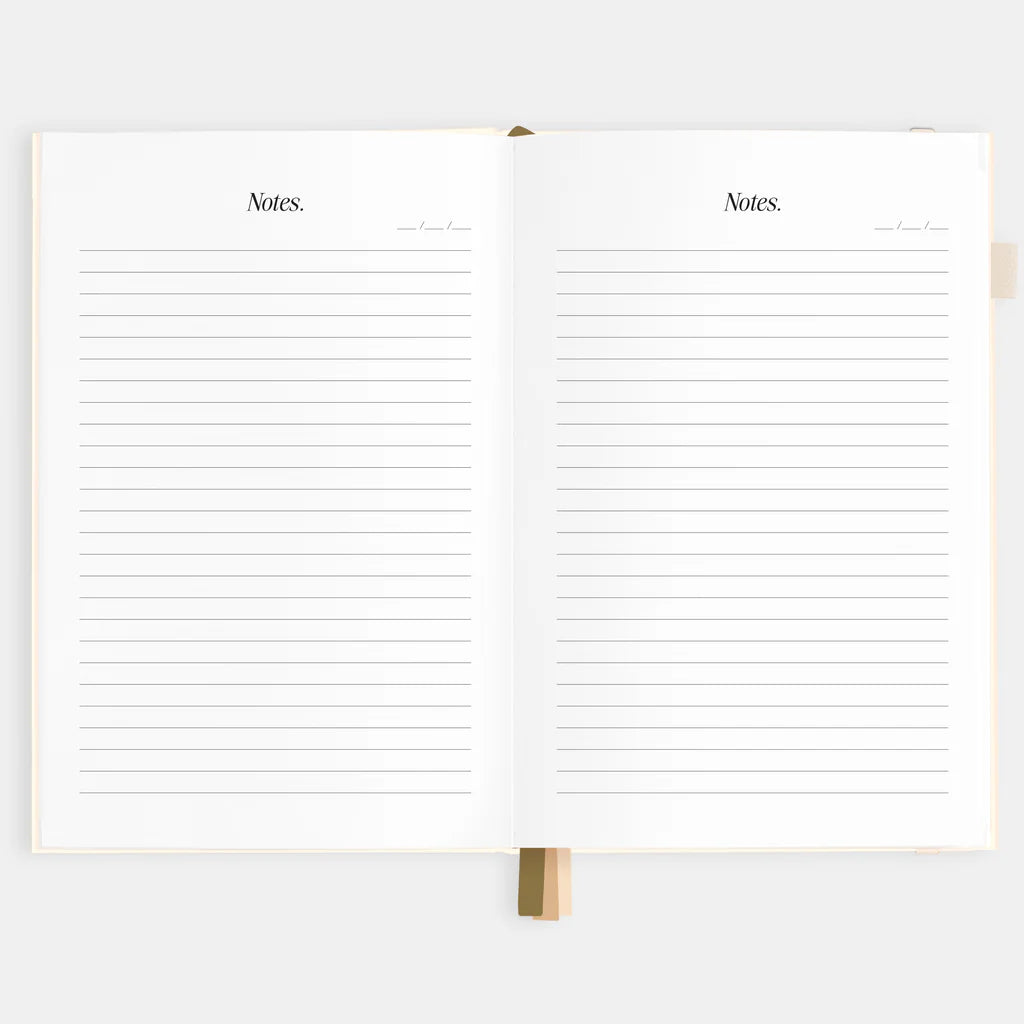 Open notebook with lined pages on a white background