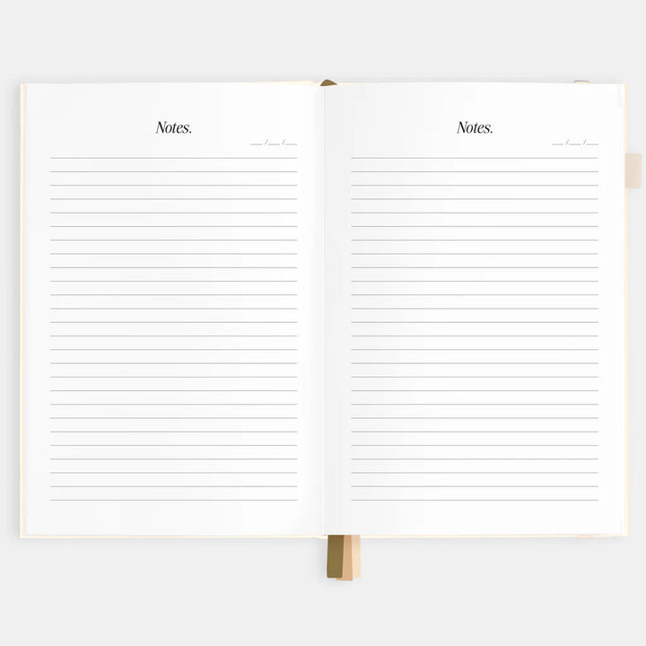 Open notebook with lined pages on a white background