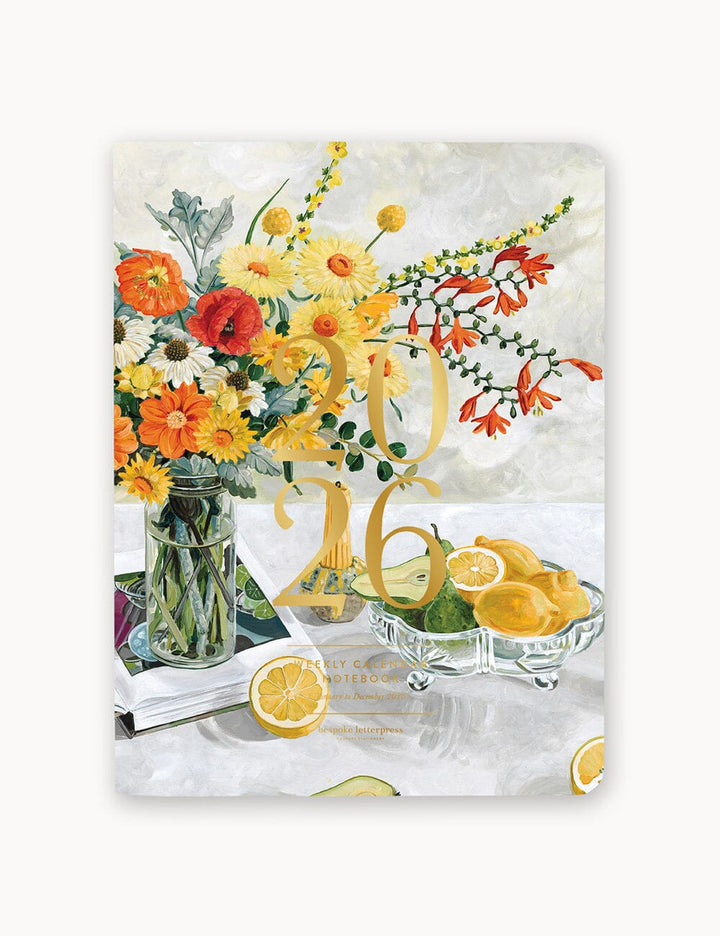 Floral design with lemons and a vase on a decorative background