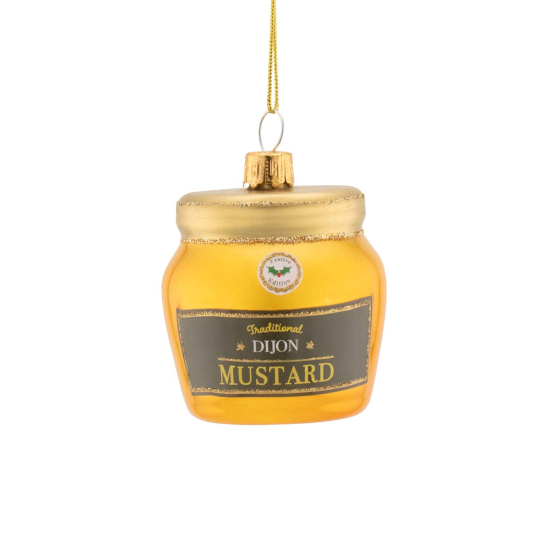 Mustard jar ornament with gold lid on a white background