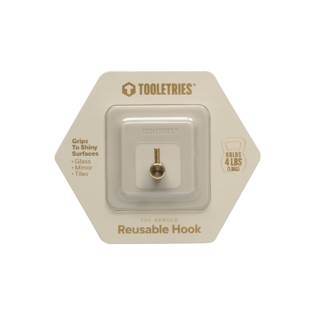 Sand coloured silicone reusable hook in packaging on a white background