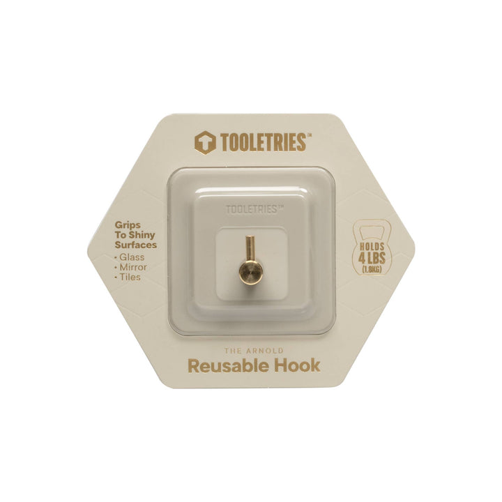 Sand coloured silicone reusable hook in packaging on a white background