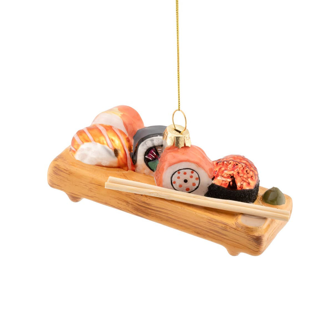 Decorative ornament resembling a sushi platter with various sushi rolls on a white background