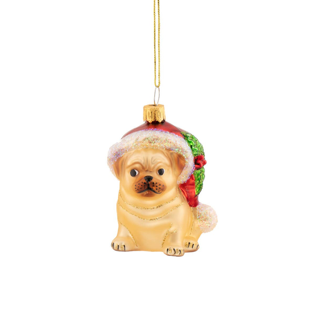 Dog-shaped Christmas ornament with a red hat on a white background