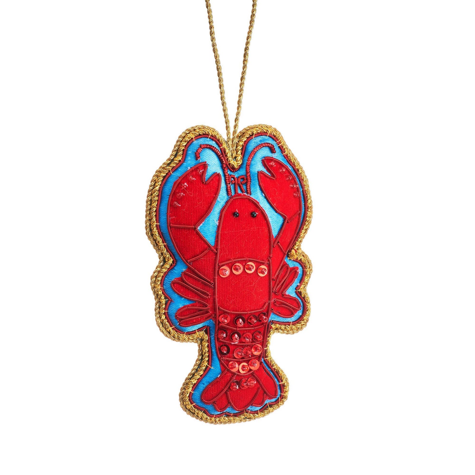 A lobster-shaped fabric ornament or decoration featuring a red lobster body with blue accents, a gold braided border, and a gold hanging string, shown on a plain white background.