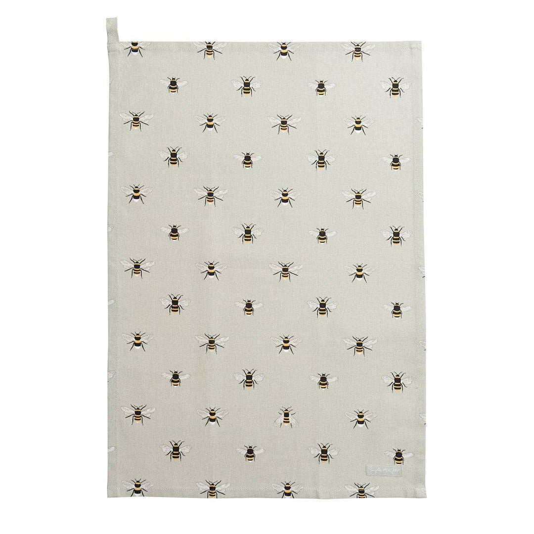 A rectangular kitchen tea towel with a hanging loop at the top left, featuring a repeating pattern of small bumblebees on a light beige background.