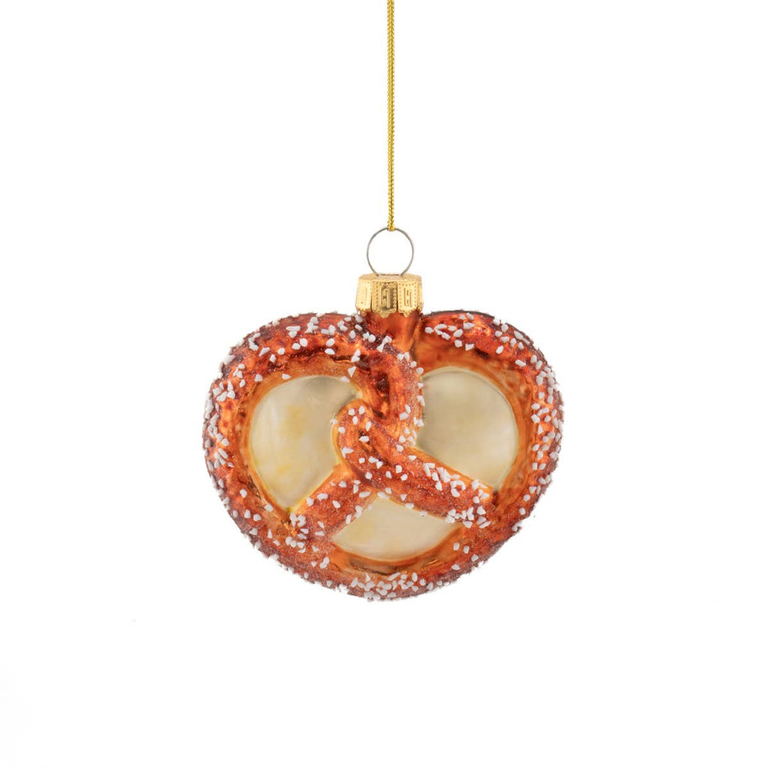 Heart-shaped pretzel ornament with gold hook on a white background