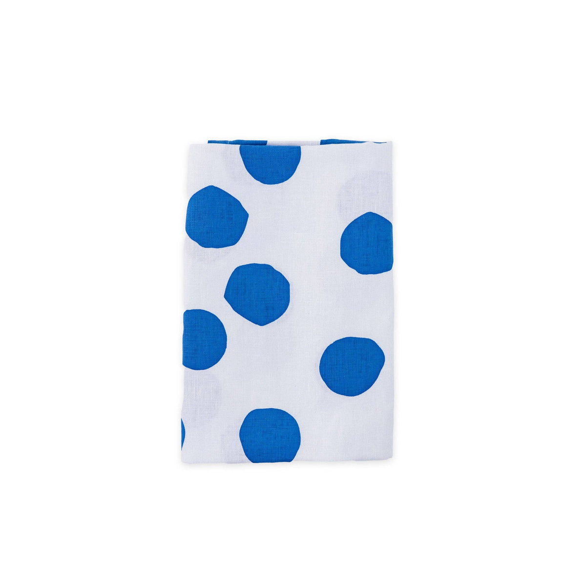 White linen napkin with large blue polka dots on a white background