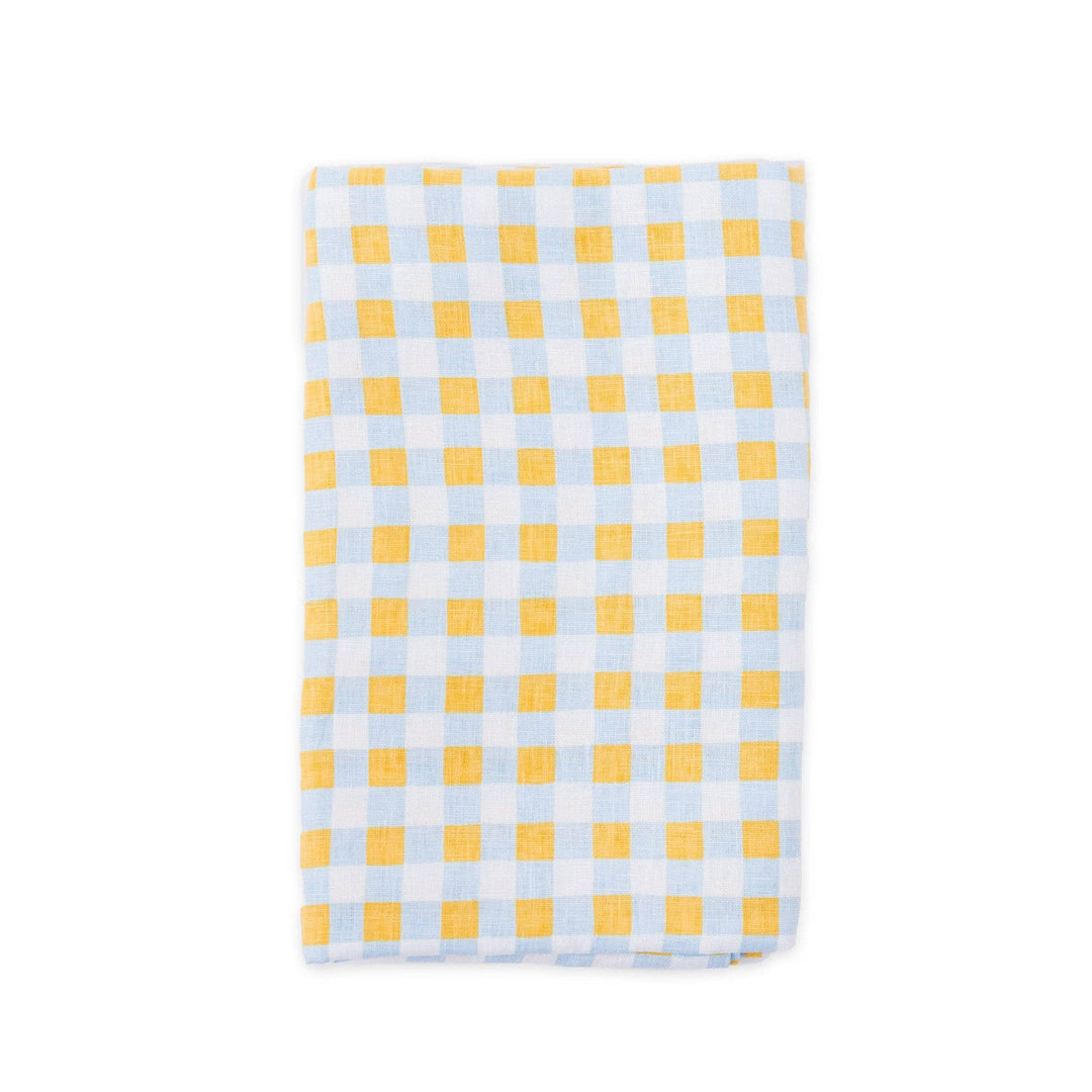 Yellow and blue check linen napkin on a white background