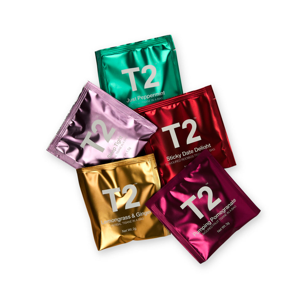 Five T2 tea sachets in different colors on a white background