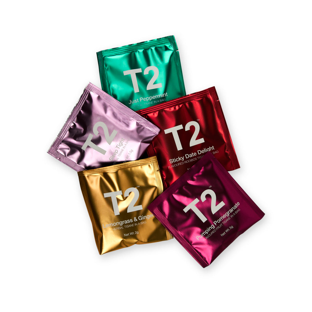 Five T2 tea sachets in different colors on a white background