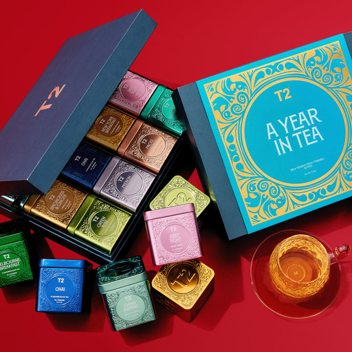 T2 tea box set with various tea packages on a red background