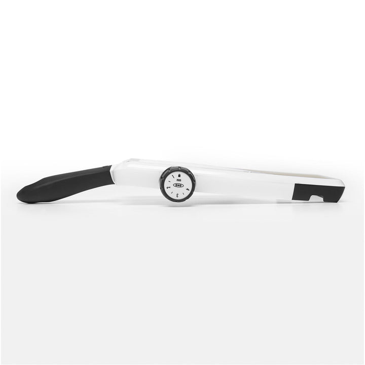 White mandoline slicer with black accents on a white background