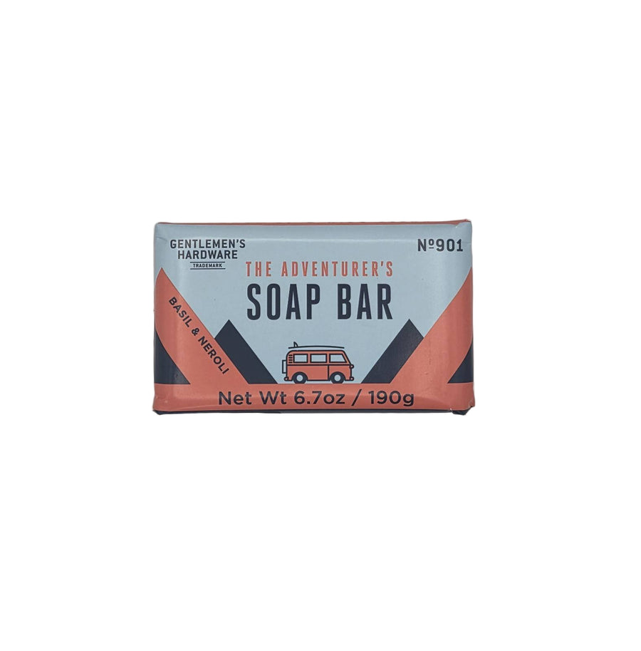 Soap bar packaging with 'The Adventurer's Soap Bar' branding on a light gray background