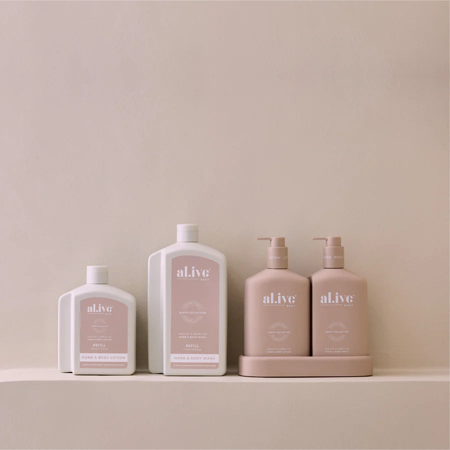 Set of 'alive' skincare products on a beige background
