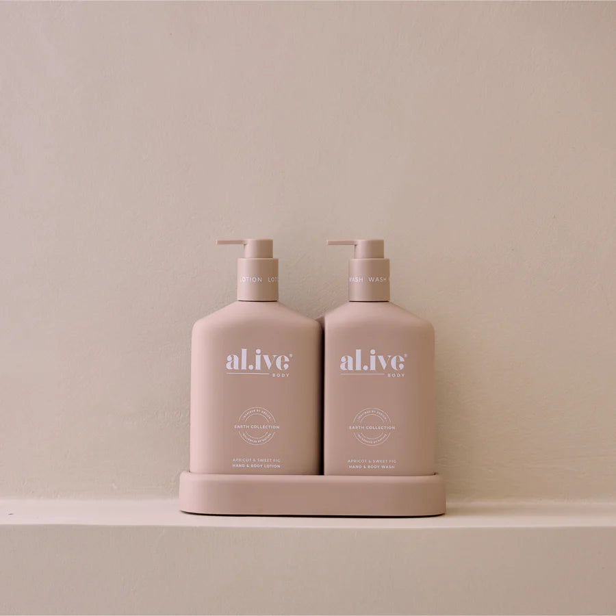 Two beige bottles with pump dispensers labeled 'alive' on a beige background