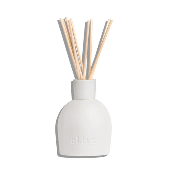 White diffuser with wooden sticks on a white background