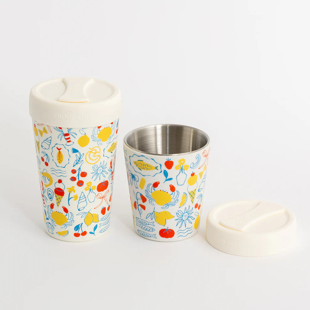 Two reusable cups with colorful sea-themed pattern on a white background