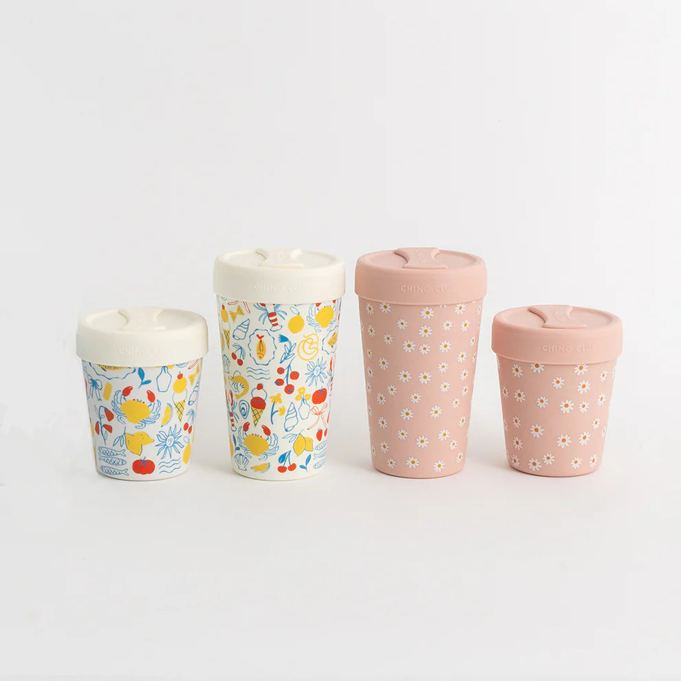 Four patterned cups on a light gray background