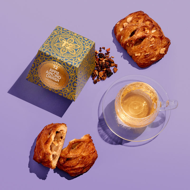 T2 Apple almond danish tea box with danish and glass cup and saucer of tea 