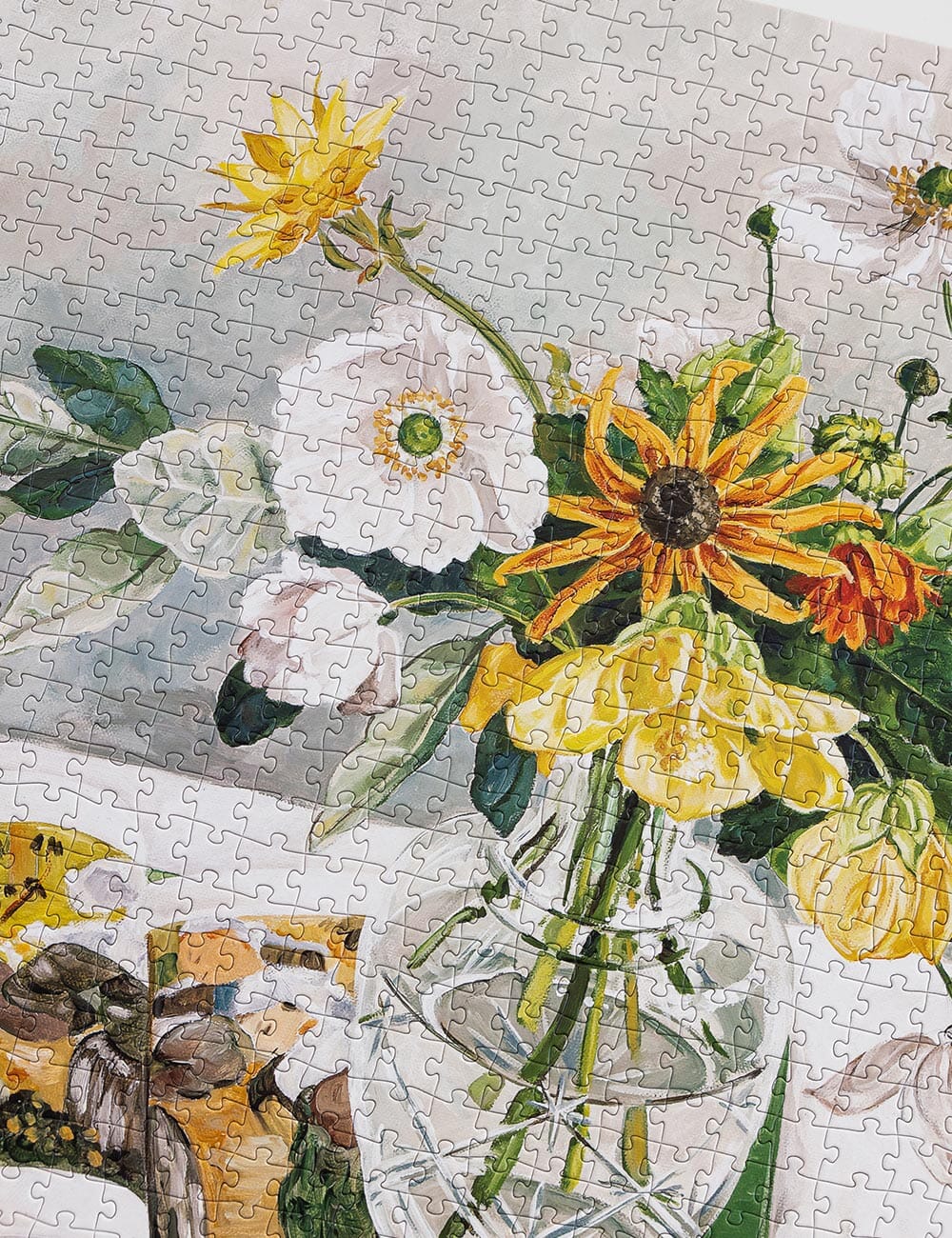 Jigsaw puzzle with a floral design, featuring yellow and white flowers.