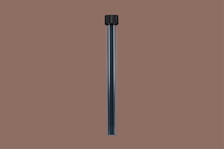 Black cylindrical object with incense sticks inside on a brown background