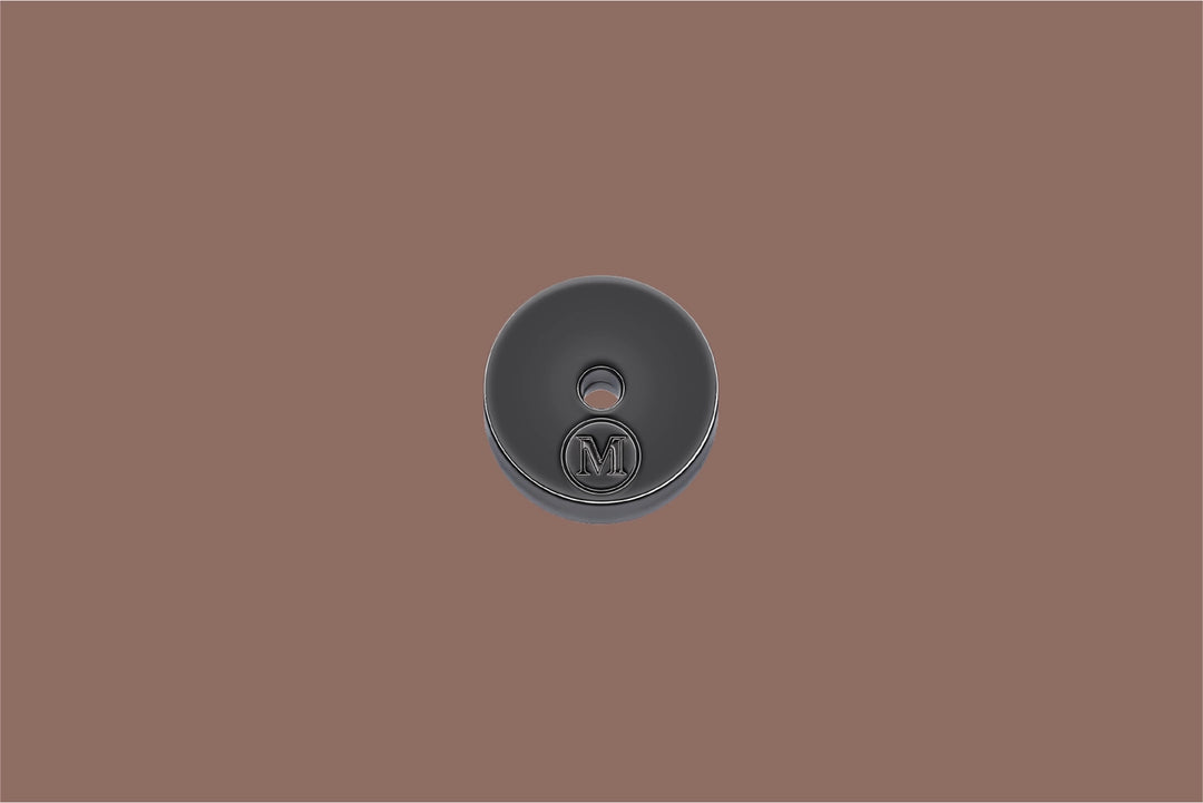 Dark gray incense holder with a logo on a brown background