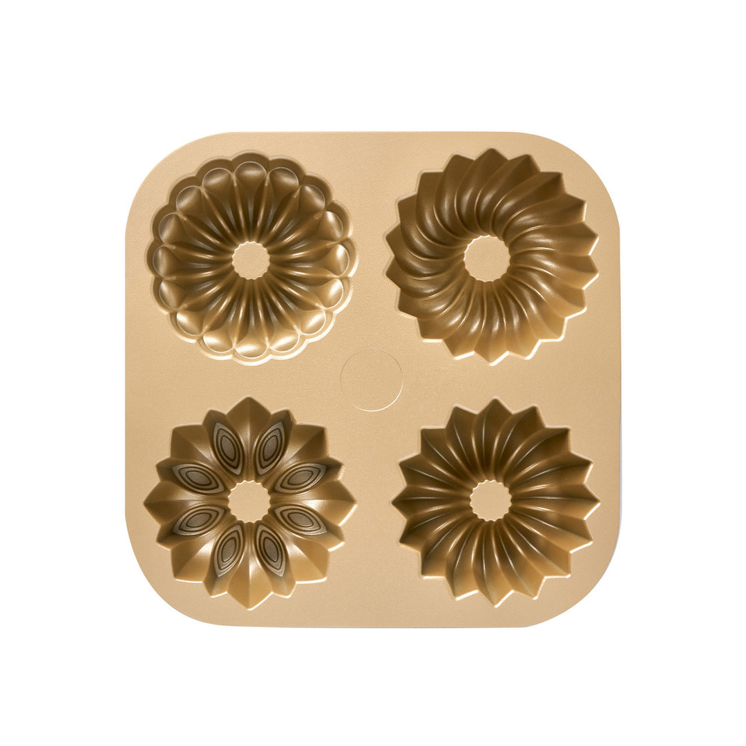 Gold bundt mold on a white background