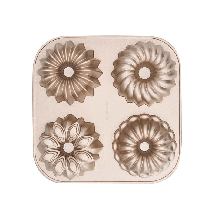 Metal cake mold on a beige background