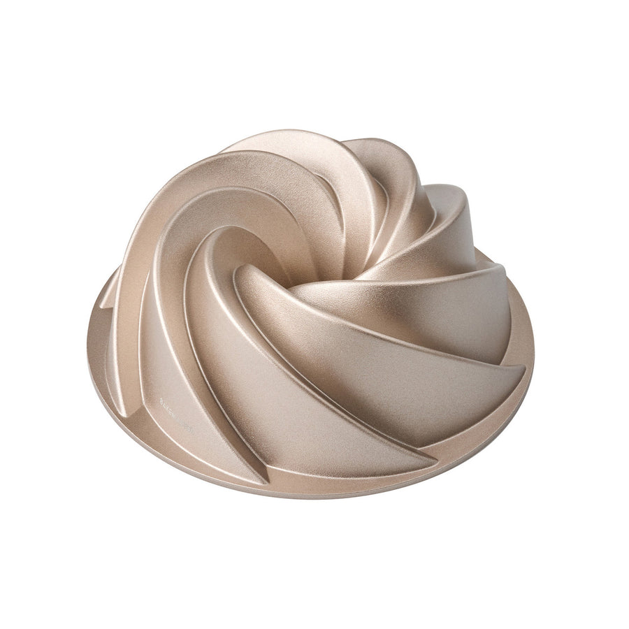 Gold cake mold on a white background